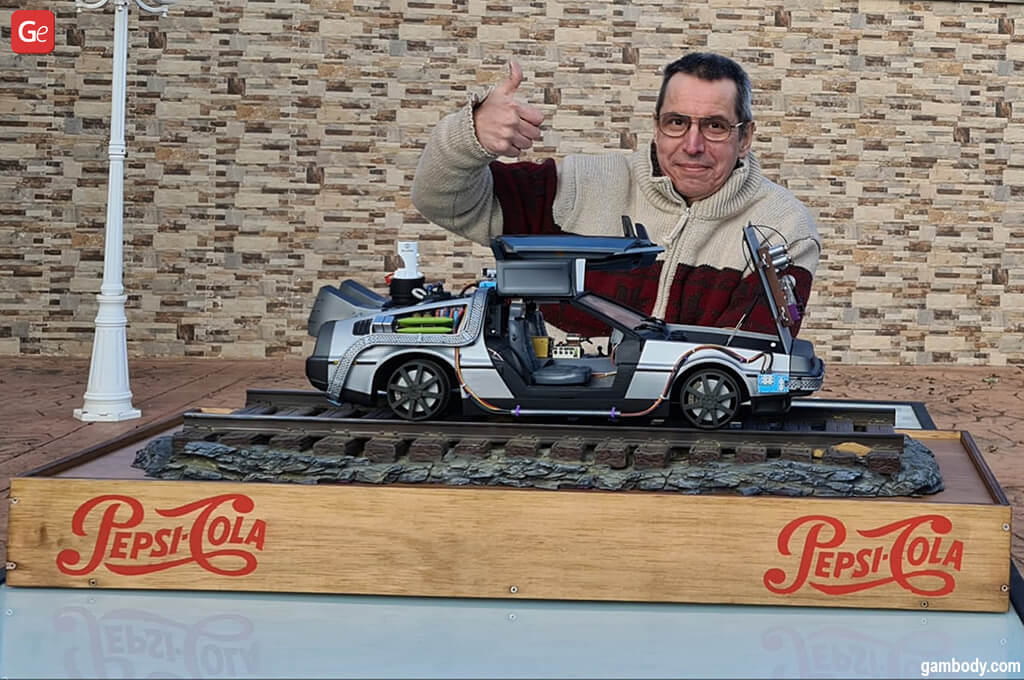 Carlos Diaz with a 3D printed DeLorean car