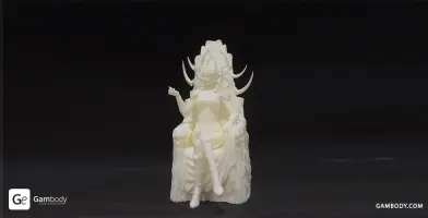 A 3D printed figure of a character seated on a throne with intricate headpiece and detailed attire.