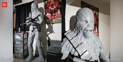 A detailed 3D-printed Chewbacca model, holding a weapon and wearing a bandolier.