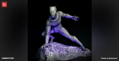 3D model of a superhero crouched on a rock, ready to leap, with intricate suit details.