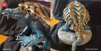Blue and orange armored creature model on a base; features spiked shell and claws for 3D printing.