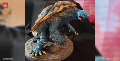 A detailed 3D model of Gamera, a turtle-like creature with a spiked shell, posed on a base.