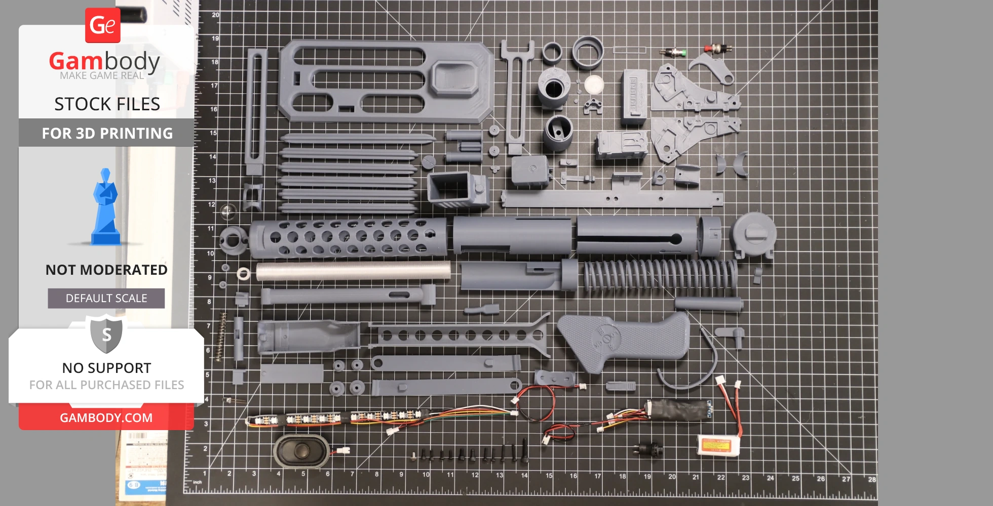 Disassembled 3D printed parts for a Stormtrooper blaster (E-11), laid out on a grid mat.
