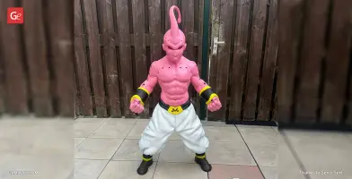 Pink muscular character from Dragon Ball with white pants, black and yellow accents, standing in a strong pose.
