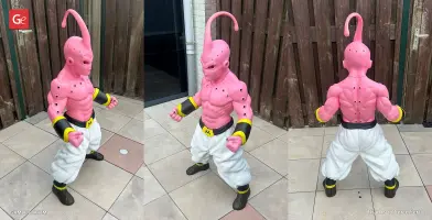 Pink humanoid figure with muscular build, white pants, black boots, and a distinctive head crest.