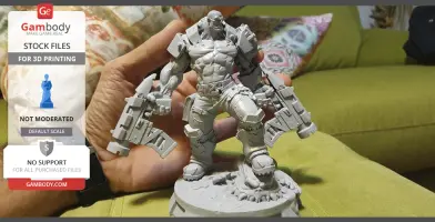 A detailed 3D printed model of an Orc Cyborg holding large weapons, standing on a decorative base.