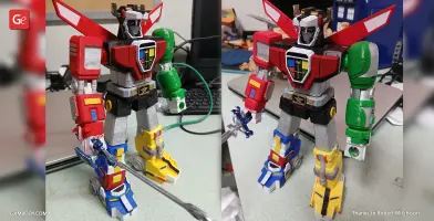 A colorful 3D printed model of Voltron, the robot warrior, with red, green, and blue lion parts.