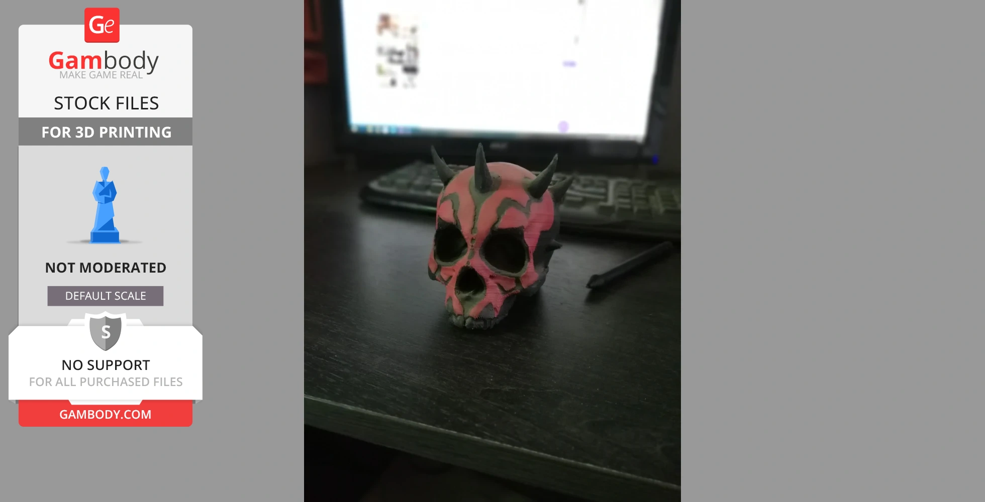 A painted Darth Maul-inspired skull model with horns, placed on a desk in front of a computer.