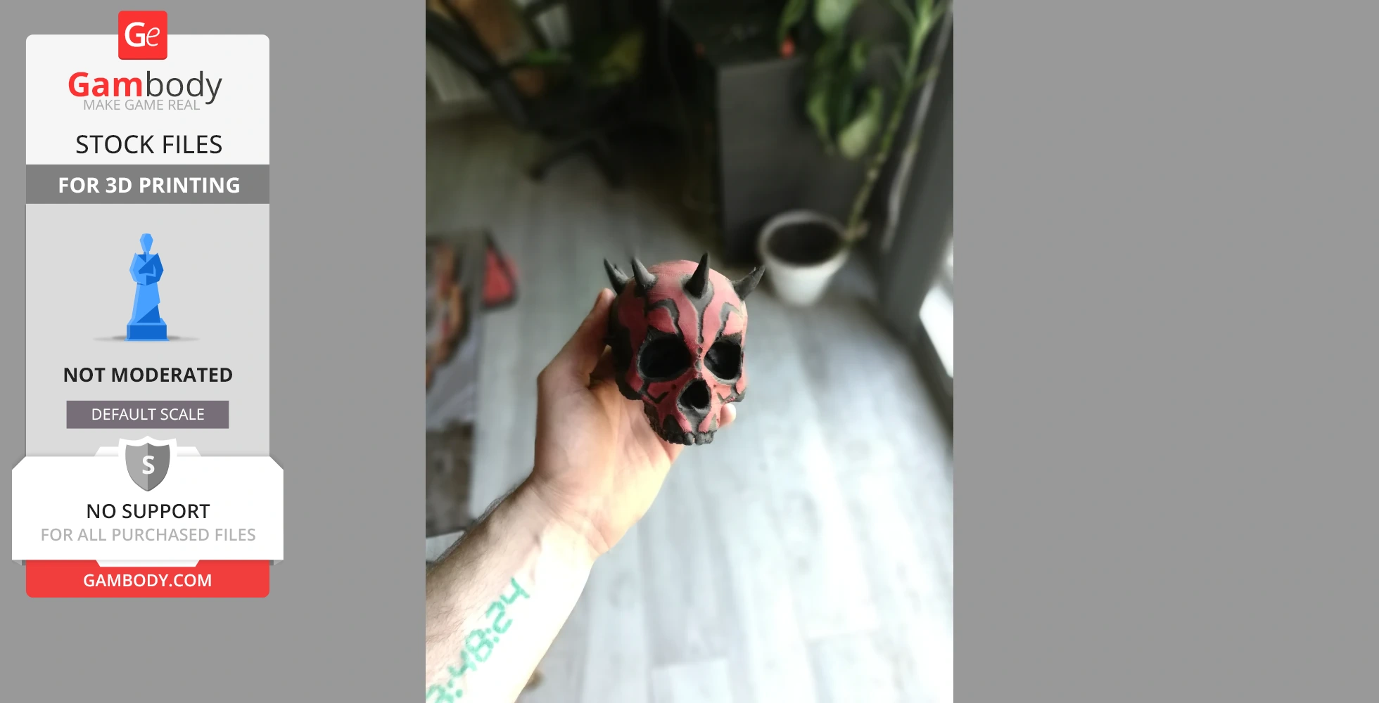 A hand holding a red and black spiked skull, designed for 3D printing, resembling a Sith character.