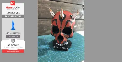 A red and black skull with horns, inspired by Darth Maul, displayed on a base with his nameplate.