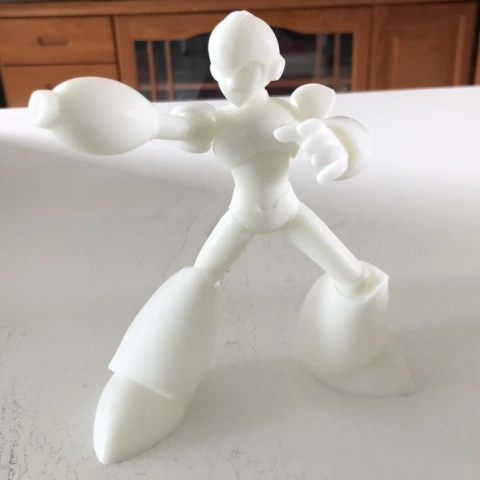 3D printed figure of Megaman X in action pose, showcasing base armor details.