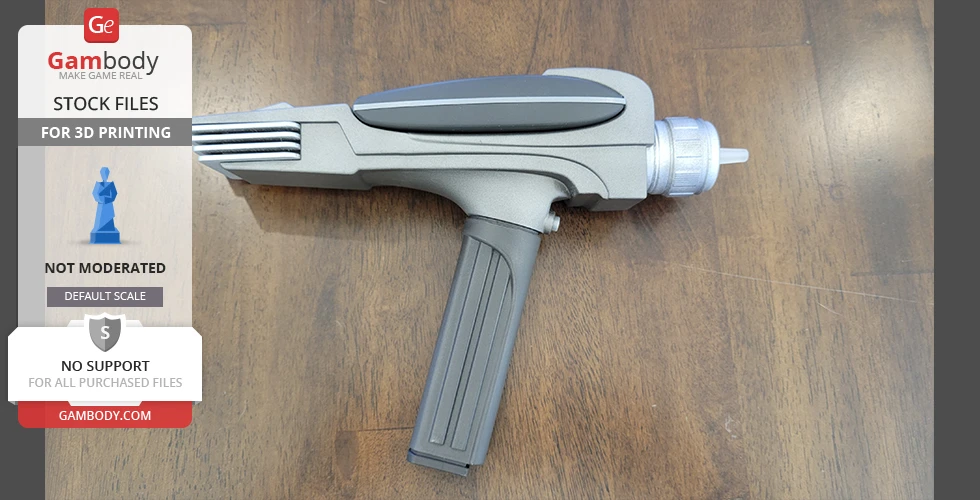 A gray, futuristic Star Trek Phaser MK2 prop on a wooden surface.