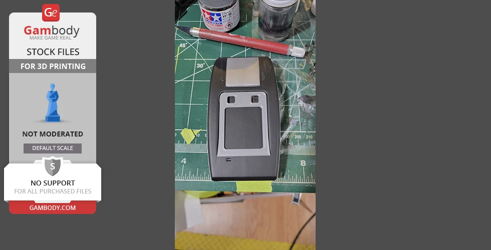 A 3D-printed Star Trek Phaser MK2 on a crafting table with tools and paint jars.