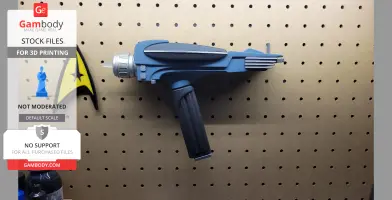 A blue Star Trek Phaser MK2 model mounted on a pegboard, with a black handle and metallic details.