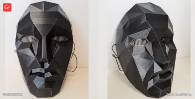 Faceted black mask with angular features and mesh eye openings, inspired by Squid Game.