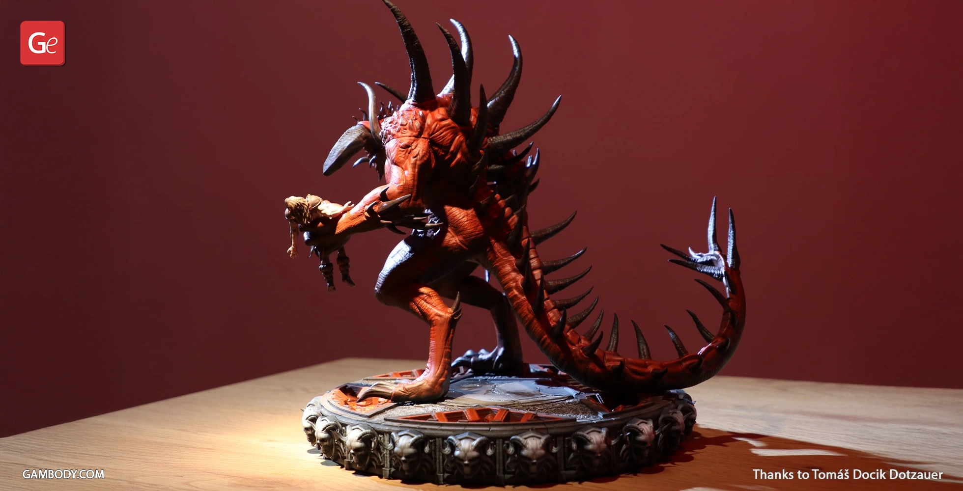A detailed 3D model of a spiked demon creature on a textured base, captured in dramatic lighting.