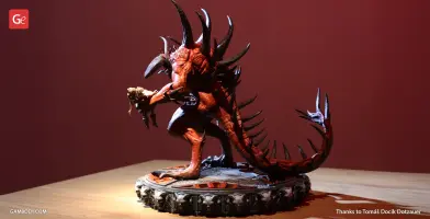 A detailed 3D model of a spiked demon creature on a textured base, captured in dramatic lighting.