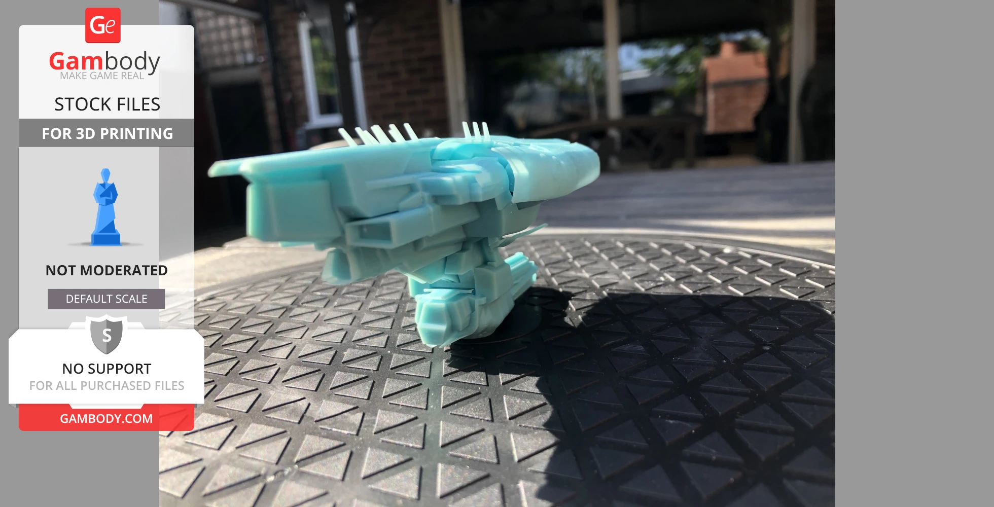 Aqua-colored 3D-printed spaceship model with geometric details on outdoor surface.