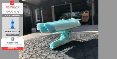 A small, detailed 3D-printed model of a spaceship, 'Leshak,' in a light blue material, displayed outdoors.