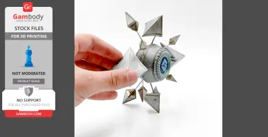 A hand holding a 3D-printed, geometric shell with angular metallic designs and a central circular detail.