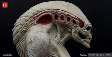 A detailed 3D model of an alien creature with textured skin and pronounced ridges on its head.