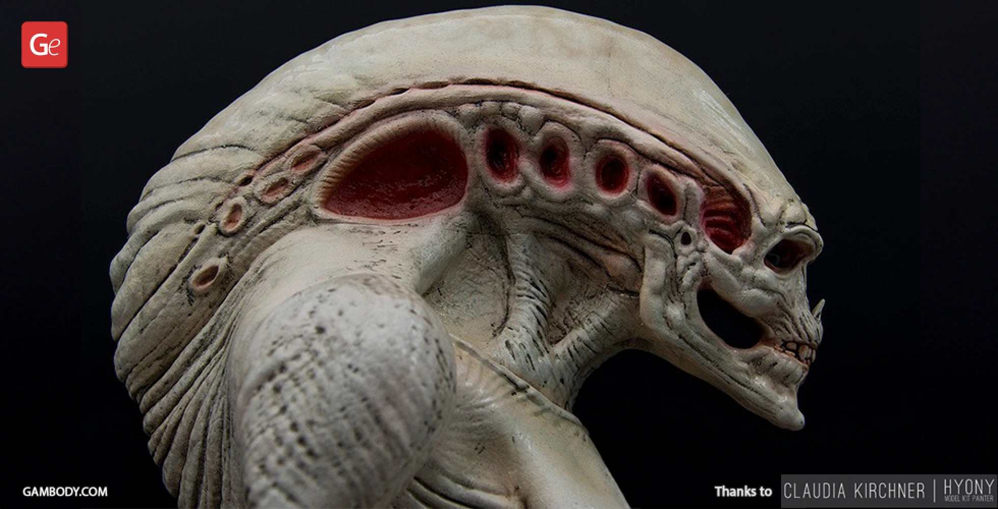 A detailed 3D model of an alien creature with textured skin and pronounced ridges on its head.