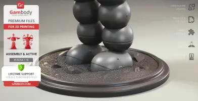 A 3D model base with spherical black legs, surrounded by rocks on a textured surface.