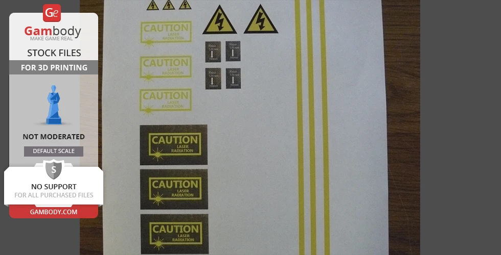 Warning labels and decals for a laser pistol 3D model, with caution and voltage symbols on white paper.