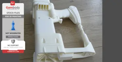 3D printed Fallout laser pistol model, unpainted, on a wooden surface.