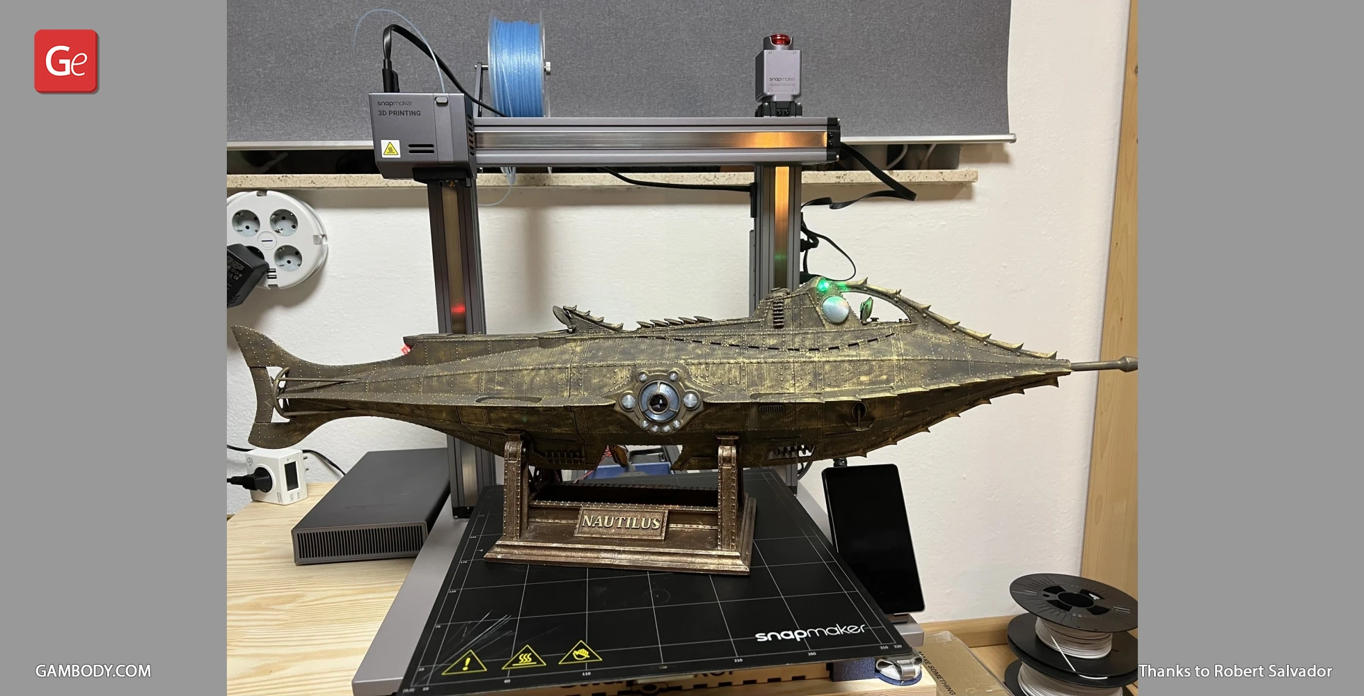 A 3D-printed model of the Nautilus submarine on display, set on a Snapmaker 3D printer.