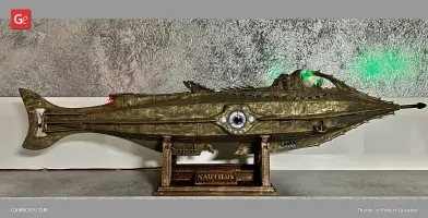 Detailed bronze Nautilus submarine model on a stand, featuring intricate designs and green/red lights.