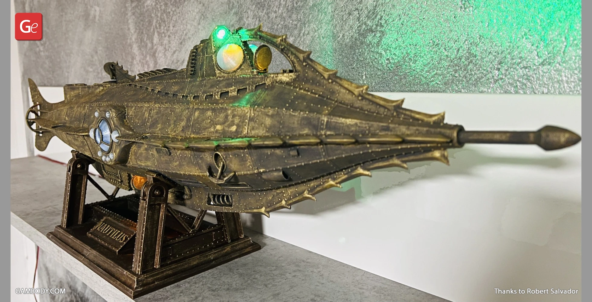 Detailed 3D model of Nautilus submarine with lights, displayed on a stand.