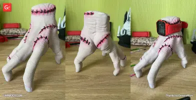 3D printed model of a stitched, disembodied hand, designed to hold small items.