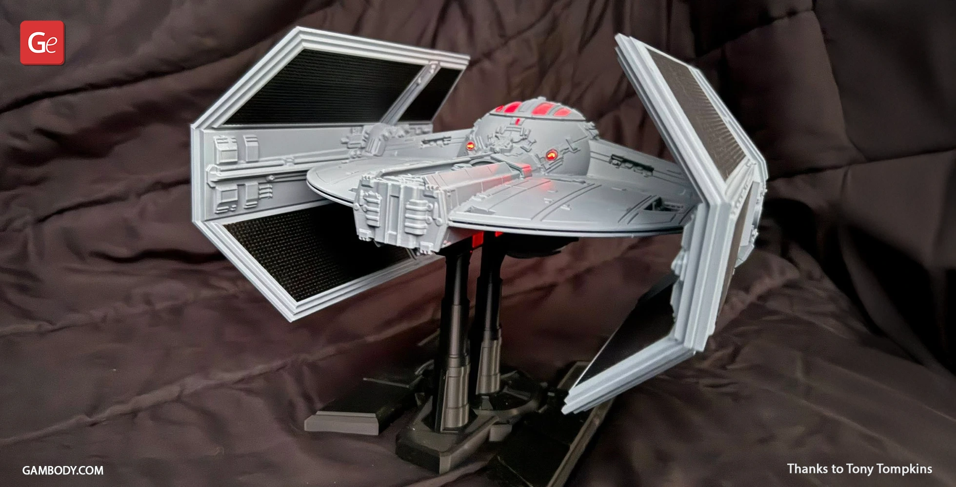 Detailed TIE Advanced 3D model on stand, featuring angular wings and cockpit, ready for 3D printing.
