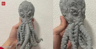 A 3D printed model of Cthulhu's head with tentacles and detailed features, in gray material.