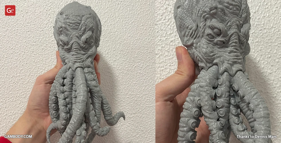 A 3D printed model of Cthulhu's head with tentacles and detailed features, in gray material.