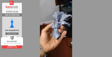 A hand holds a gray 3D-printed bust of a warrior woman with flowing hair and extended arm.