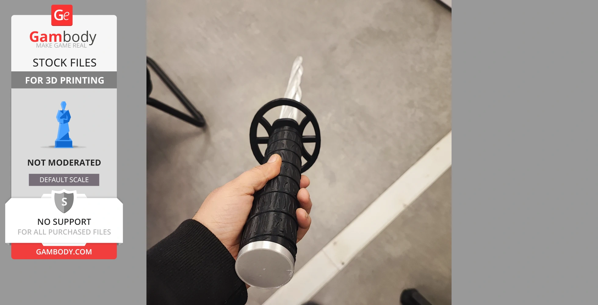 A hand holding a black and silver 3D-printed sword with a circular guard.
