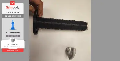 A hand holding a detailed 3D-printed sword handle and a separate circular piece on a white surface.