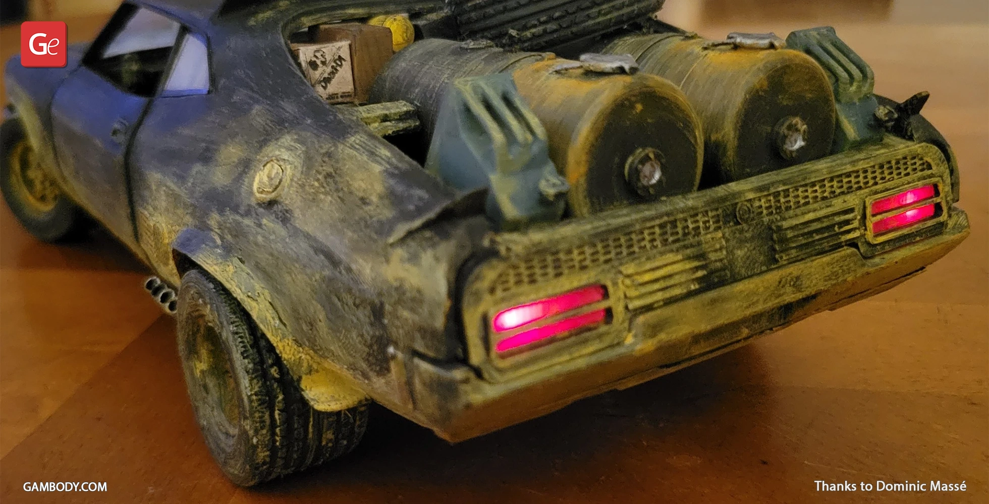 Rusty Ford Falcon XB 3D model with red taillights and rear barrels on display.