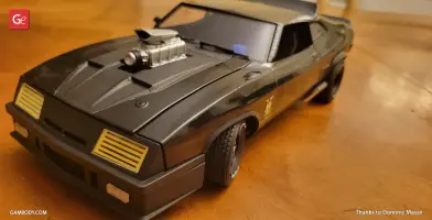 3D model of a black Ford Falcon XB with a prominent hood scoop on a wooden surface.