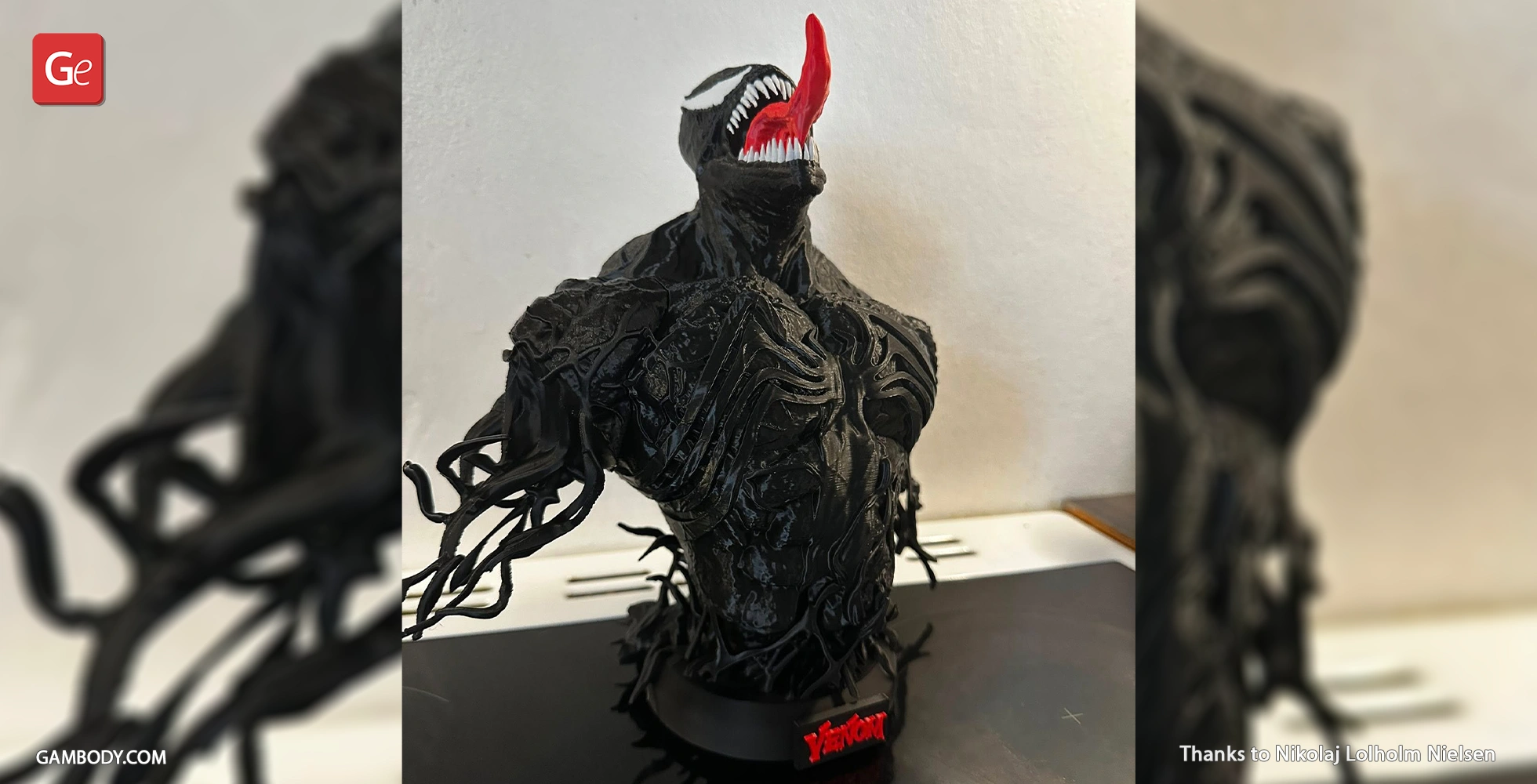 Detailed black Venom bust with open mouth and red tongue, featuring tendrils and muscular texture.