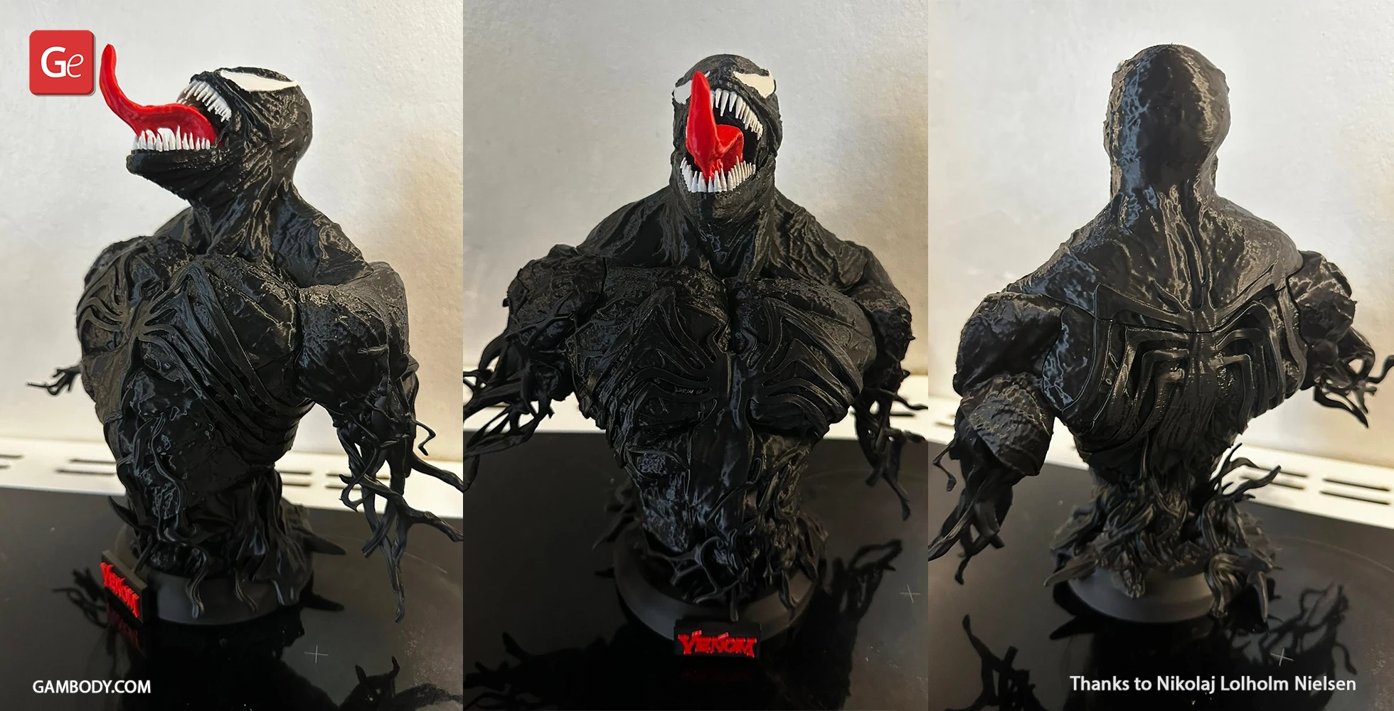 A detailed, black Venom bust 3D model with a toothy grin and extended red tongue.