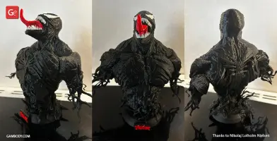 A detailed, black Venom bust 3D model with a toothy grin and extended red tongue.