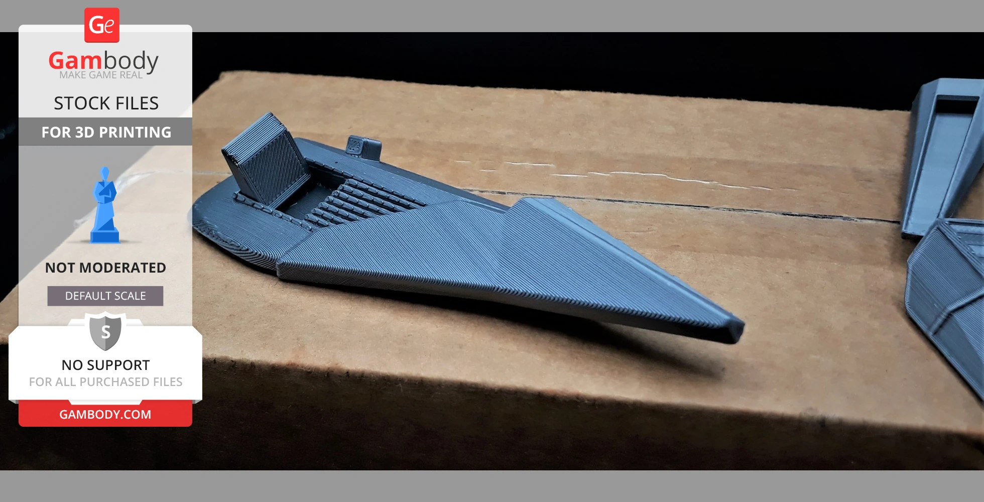 A 3D-printed, futuristic spaceship model from Wipeout on a cardboard surface.