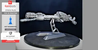 Intricate silver spaceship model on a display stand, featuring detailed mechanical components.