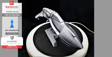 Futuristic 3D-printed spaceship model with sleek design, displayed on a circular stand.