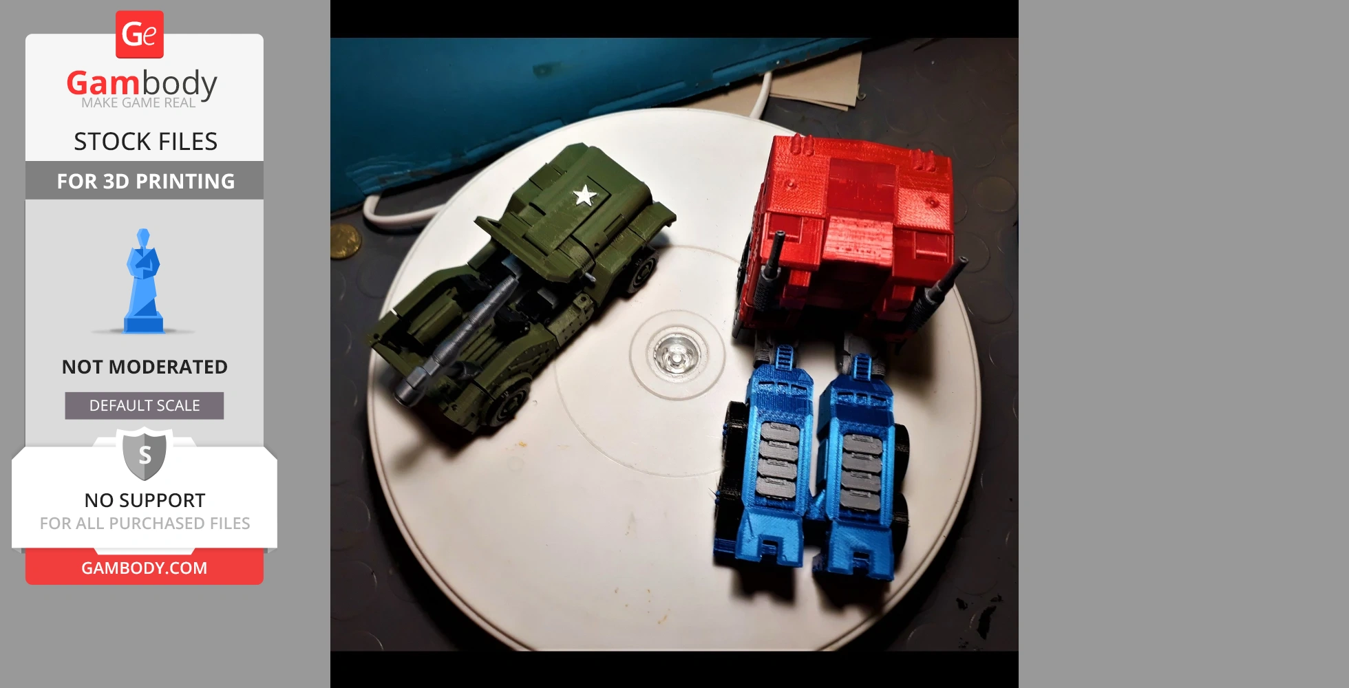Three 3D-printed toy vehicles: green military, red truck, and blue tanks on a circular platform.