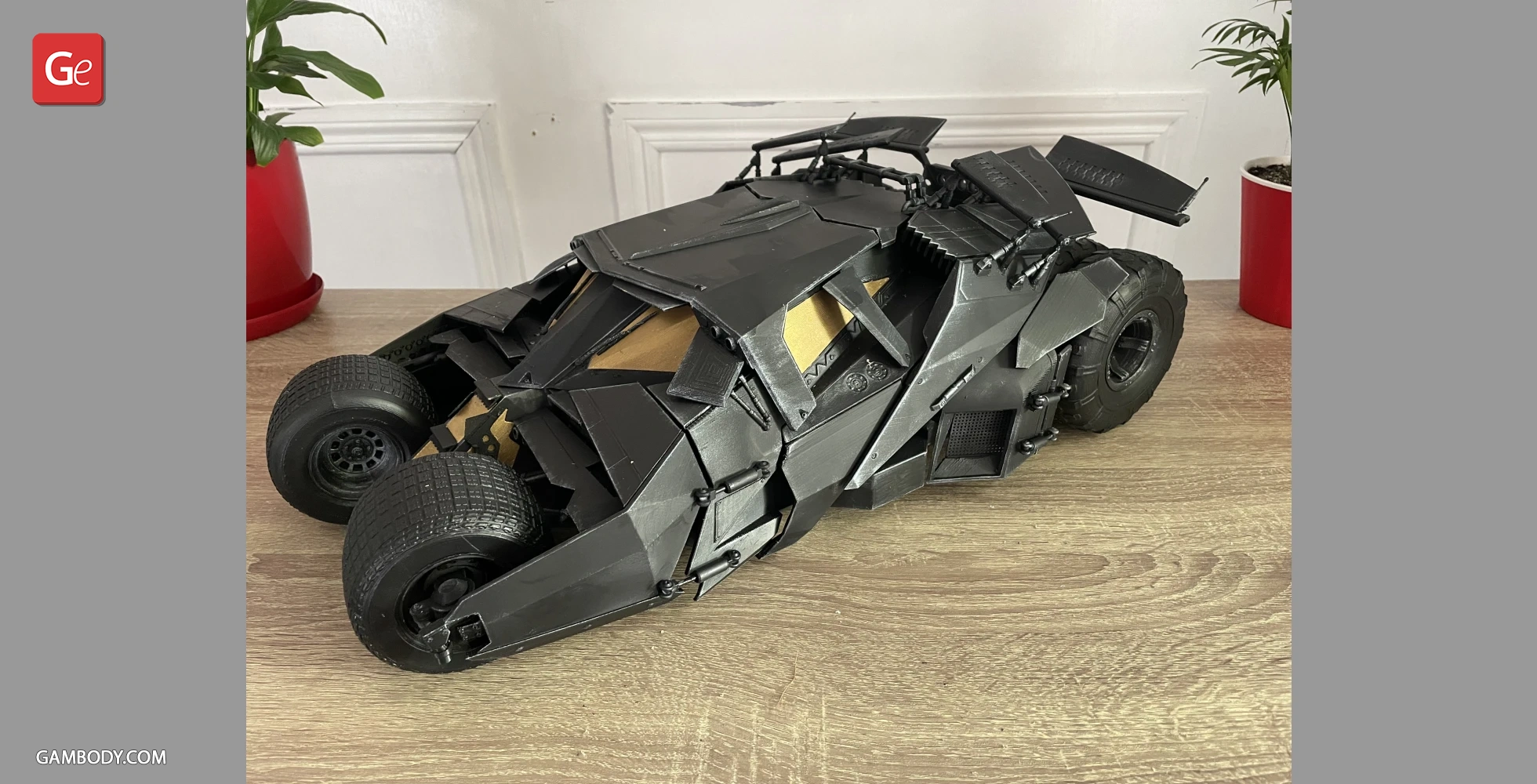 A detailed 3D-printed model of the Batmobile Tumbler from 'The Dark Knight,' in black color.