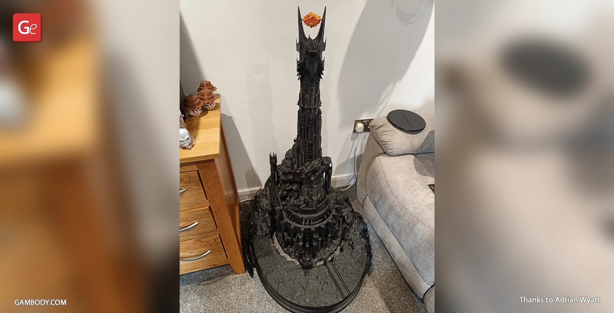 Intricate 3D model of Barad-dûr, the dark tower, with the Eye of Sauron on top, displayed indoors.